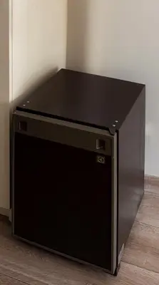 a large black television sitting on the floor at De Witte Meren in Keerbergen