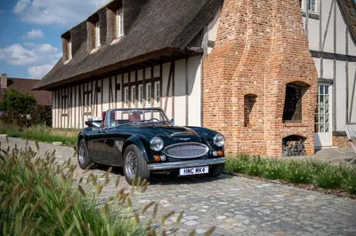 a black car parked in front of a brick building at Anno 1673 in Evergem