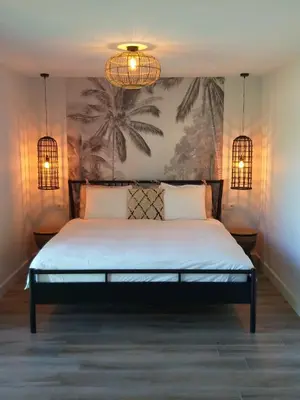 a bedroom with a bed with two lights on it at Landhuys Odette in Retie