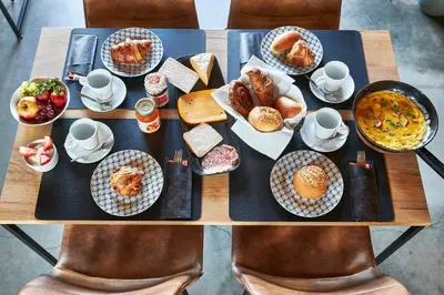 a table with plates of food on top at Kamerrijk in Pepingen