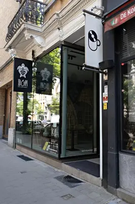 a store front of a store with signs on it at Luxury Suites South by Rikas Hotels in Antwerp