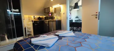 a bedroom with a bed with towels on it at Penthouse 40 m2 in Zemst