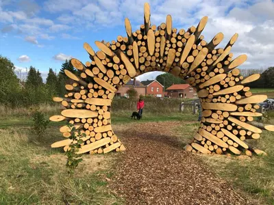 a sculpture of a bunch of wooden baseball bats at Linden-Jachthoorn in Lubbeek
