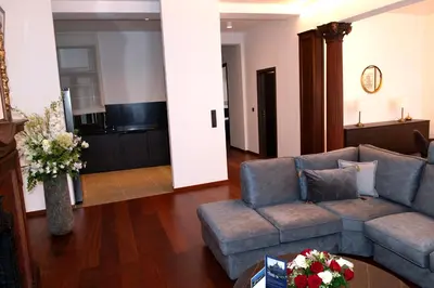 a living room with a couch and a table at Botanique Suites AirBnB, Antwerp in Antwerp