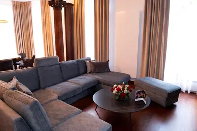 a living room with a couch and a table at Botanique Suites AirBnB, Antwerp in Antwerp