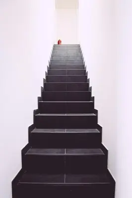 a person standing at the top of a stair case at K&Y suite 1 Brussels airport 500m! in Zaventem