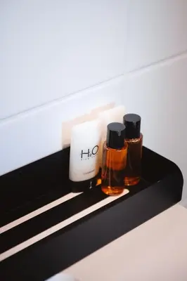 two bottles of essential oils sitting on a shelf at K&Y suite 1 Brussels airport 500m! in Zaventem