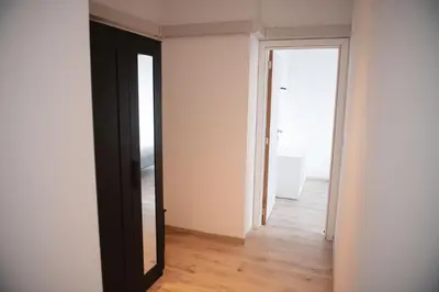 an empty room with a black door and a mirror at K&Y suite 1 Brussels airport 500m! in Zaventem
