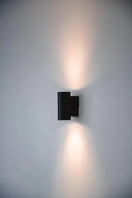 a black wall mounted lightswitch on a white wall at K&Y suite 1 Brussels airport 500m! in Zaventem