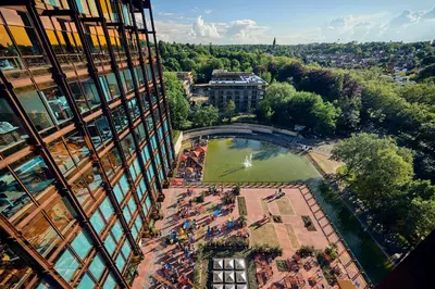 a view from the side of a building with a park at Mix Brussels --Gym & Wellness for adults only-- in Brussels