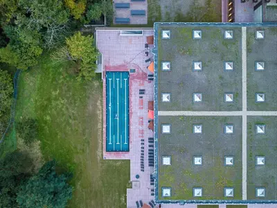an overhead view of a building with a green door at Mix Brussels --Gym & Wellness for adults only-- in Brussels