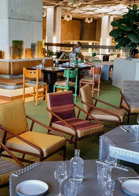 a restaurant with chairs and tables and a counter at Mix Brussels --Gym & Wellness for adults only-- in Brussels