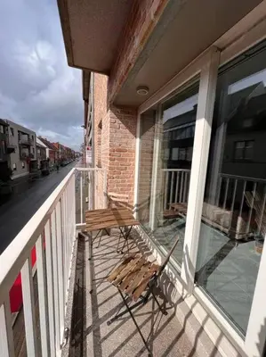 a wooden bench sitting on the balcony of a building at brugsken, Sint-Niklaas in Sint-Niklaas