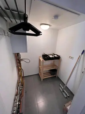 a room with a ceiling fan and a table at brugsken, Sint-Niklaas in Sint-Niklaas