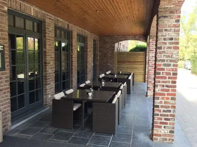a row of sinks in a brick building at Hotel ABBEY in Grimbergen