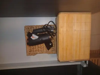 a hair dryer in a basket on a wall at Gallery Home in Brussels