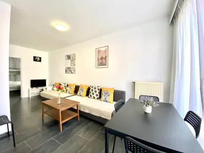 a living room with a couch and a table at Apartments Bex. in Antwerp