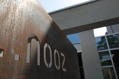 a building with a sign on the side of it at Nooz - Something Different? in Grobbendonk