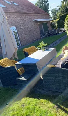 a hose is coming out of a table and umbrella at Villa71 in Rijkevorsel