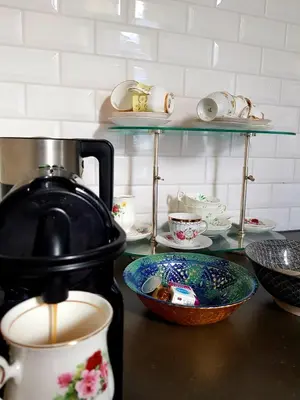 a counter with a tea pot and a bowl on a table at Perfect location & Parking in Antwerp