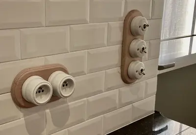 a wall with two rolls of toilet paper on it at La Maison des Sources in Brussels