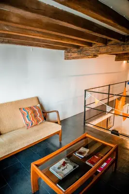a living room with a couch and a coffee table at Unieke woning in het historisch stadscentrum in Antwerp