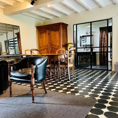 a dining room with a table and chairs at Domaine Bourgogne en Grez 