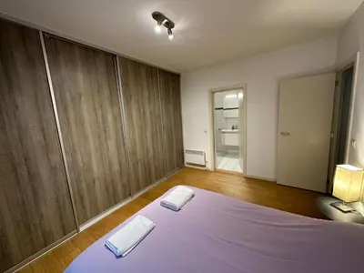 a bedroom with a bed with two towels on it at 3 Bedroom Apartment in City Center with Balcony View in Brussels