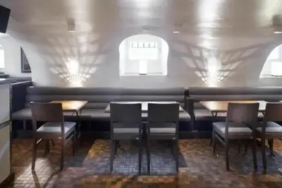 a dining room with chairs and a table in a restaurant at Gravenhof in Beersel