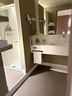 a bathroom with a sink and a shower at Gravenhof in Beersel