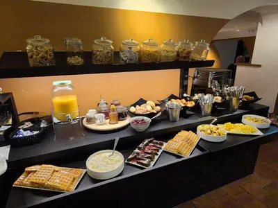 a buffet line with food and drinks on a table at Gravenhof in Beersel