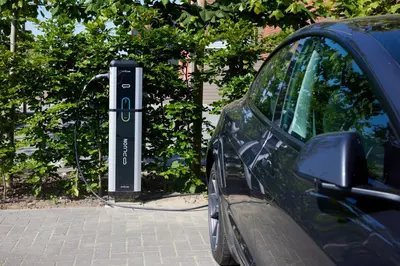 a car is parked next to a parking meter at Apartment with a view and parking in Brecht