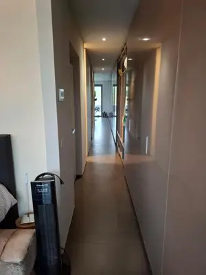 a hallway of a house with a long hallway at B&B Finis terrae in Lokeren