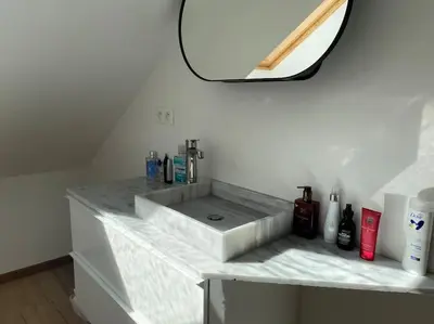 a bathroom counter with a sink and a mirror at Spacious app/Antwerp city center #003 in Antwerp