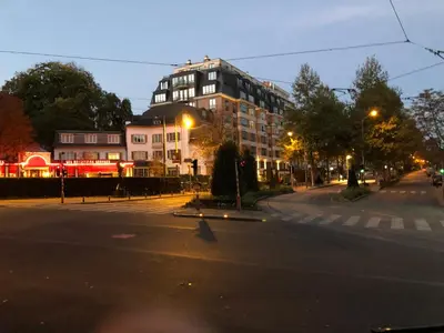 an empty city street at night with a building at Bruxelles in Brussels