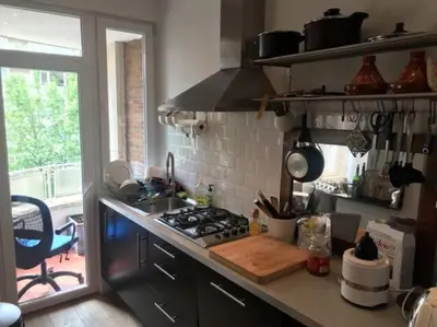 a kitchen with a stove and a sink and a window at Bruxelles in Brussels