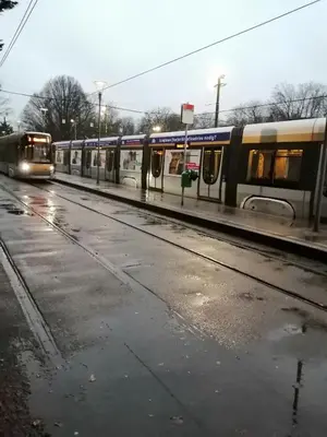 two trains on the tracks at a train station at nys willy in Grimbergen