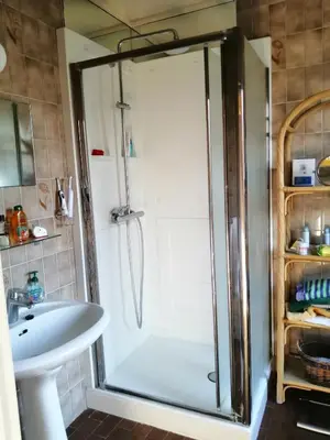 a bathroom with a shower and a sink at nys willy in Grimbergen