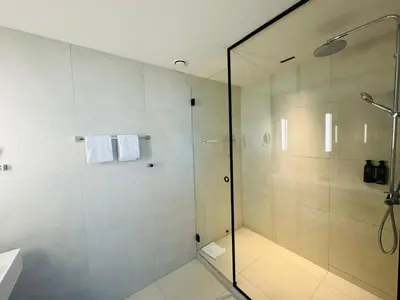 a shower with a glass door in a bathroom at OPO Hotel in Brussels