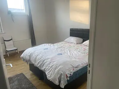 a bedroom with a bed and a chair at Bruxelles in Brussels