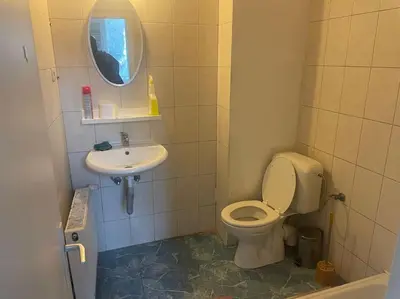 a small bathroom with a toilet and a sink at Bruxelles in Brussels
