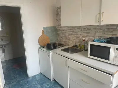 a kitchen with a sink and a microwave at Bruxelles in Brussels