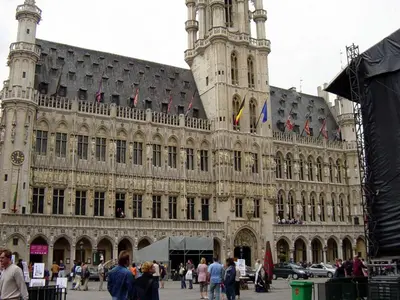 a large building with a clock tower on top of it at Hotel The Moon in Brussels