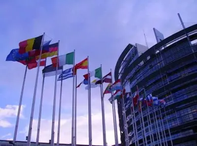 a bunch of flags in front of a building at Hotel The Moon in Brussels