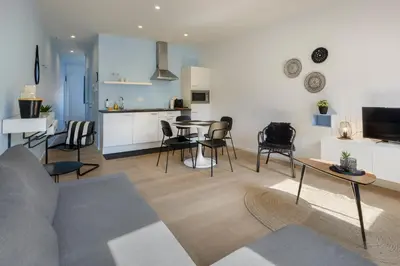 a living room with a couch and a table at R73 Apartments by Domani Hotels in Antwerp