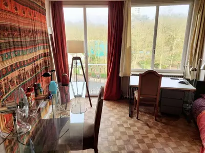 a bedroom with a desk and a table with a desk at ImpactHorizon in Brussels