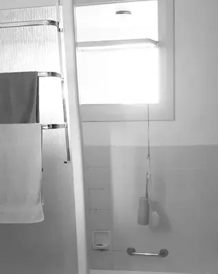 a white bathroom with a shower and a window at ImpactHorizon in Brussels