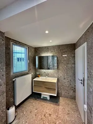a bathroom with a sink and a window at Sunny apartment @theater area in Antwerp
