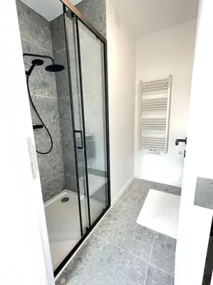 a bathroom with a shower with a glass door at #2800ourhome 202 in Mechelen