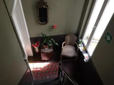 an overhead view of a staircase with a chair and a window at Vakantielogies Faja lobi in Ghent